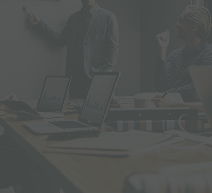 Darkened image of a board room meeting